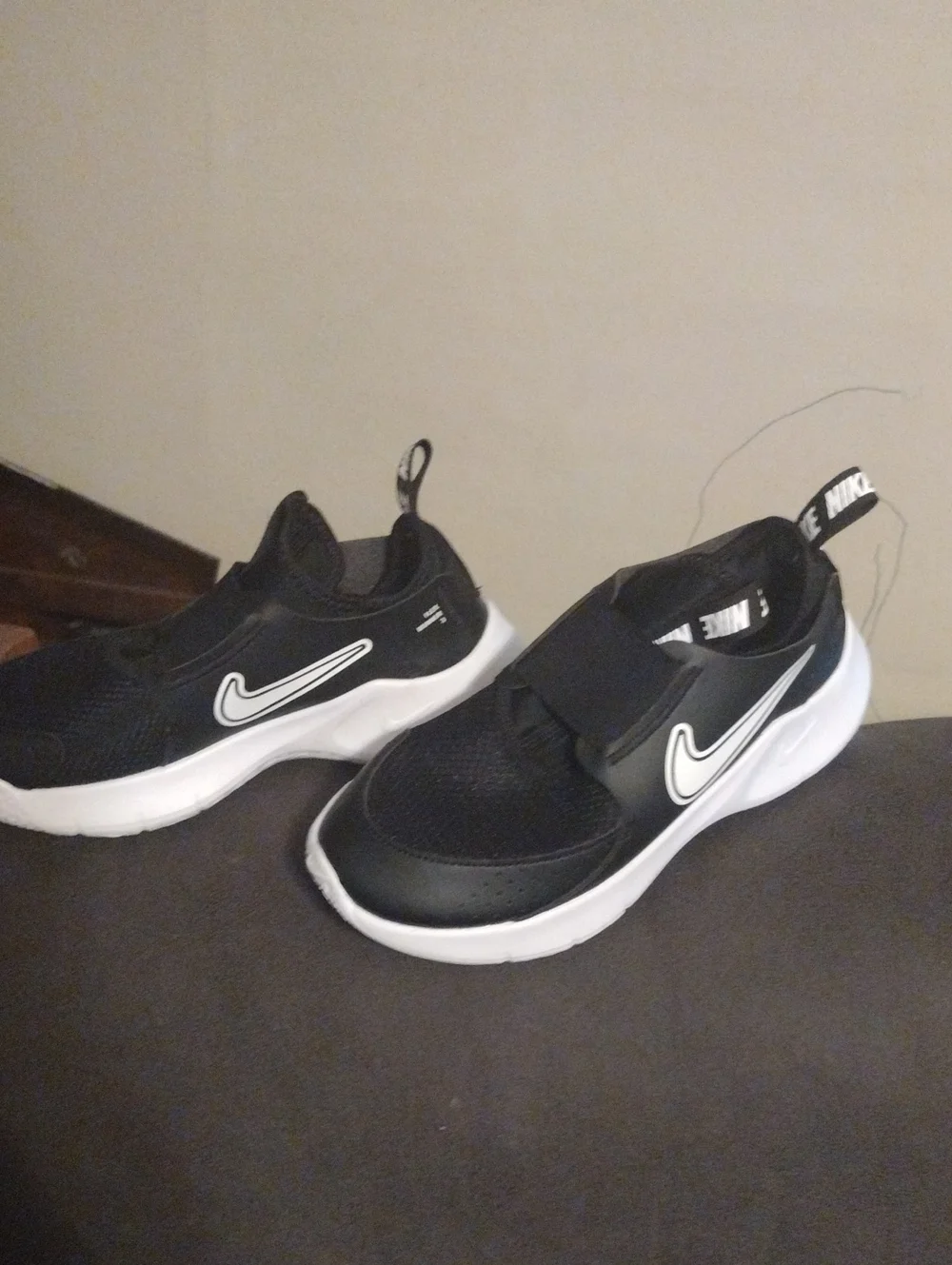 Nike Kids Black and White Slip-On Sneakers with Swoosh